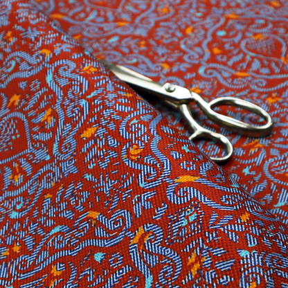 A highly detailed, textured damask that blends traditional ornate motifs with a modern, high-energy colour palette.