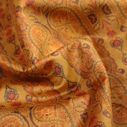 A warm, vintage-style paisley pattern with a weathered, antique tapestry aesthetic.