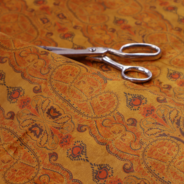 A warm, vintage-style paisley pattern with a weathered, antique tapestry aesthetic.