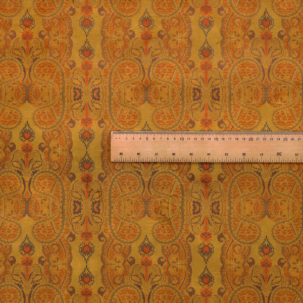 A warm, vintage-style paisley pattern with a weathered, antique tapestry aesthetic.