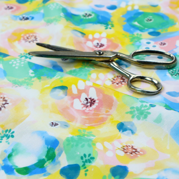 A vibrant, watercolour floral pattern with a bright and airy spring aesthetic.