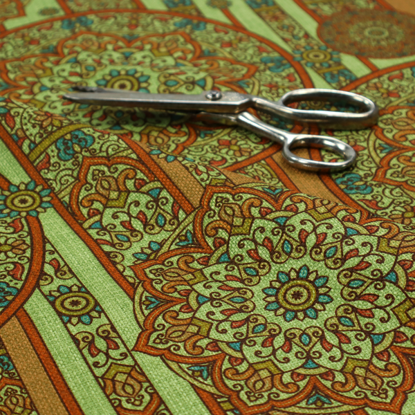 An ornate, global-inspired textile pattern that combines structured vertical stripes with intricate circular motifs.