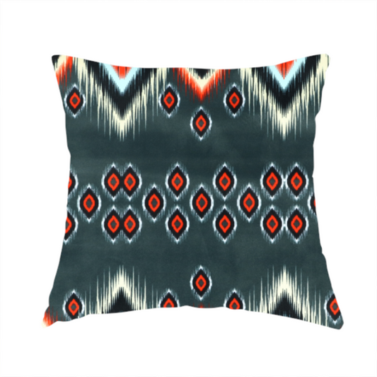 The fabric used to create this handmade cushion is a bold, high-contrast Ikat textile pattern with a modern tribal aesthetic.
