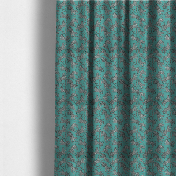The fabric used to create these made-to-measure curtains is a playful, modern wildlife pattern with a rhythmic, repeating animal motif.