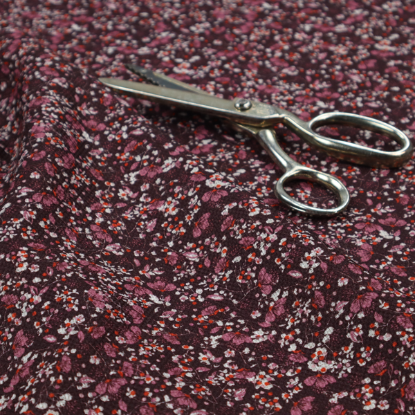 A dense, monochromatic ditsy floral pattern with a rich, romantic aesthetic.