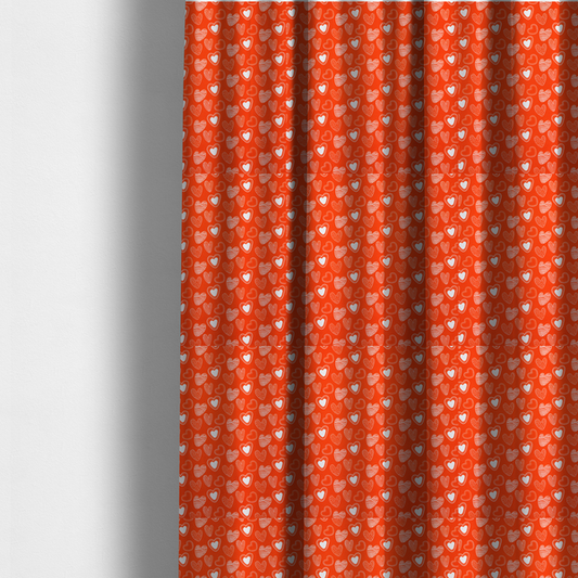 The fabric used to create these made-to-measure curtains is a vibrant red fabric features a playful, repeating pattern of white heart illustrations. The hearts are hand-drawn in several distinct styles, including solid outlines with dotted borders, sketched diagonal stripes, and intricate stippled patterns. These varied heart motifs are scattered across the bright background at different angles, creating a lively and energetic design.
