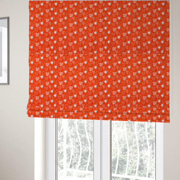 The fabric used for these Roman blinds is a vibrant red fabric features a playful, repeating pattern of white heart illustrations. The hearts are hand-drawn in several distinct styles, including solid outlines with dotted borders, sketched diagonal stripes, and intricate stippled patterns. These varied heart motifs are scattered across the bright background at different angles, creating a lively and energetic design.