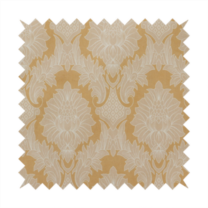 An elegant damask fabric featuring a repeating, symmetrical floral and leaf medallion pattern in cream over a warm ochre-gold background.