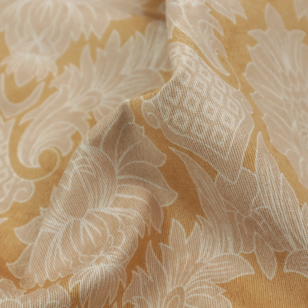 An elegant damask fabric featuring a repeating, symmetrical floral and leaf medallion pattern in cream over a warm ochre-gold background.