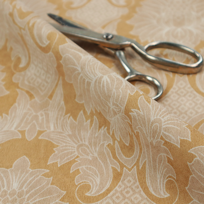 An elegant damask fabric featuring a repeating, symmetrical floral and leaf medallion pattern in cream over a warm ochre-gold background.