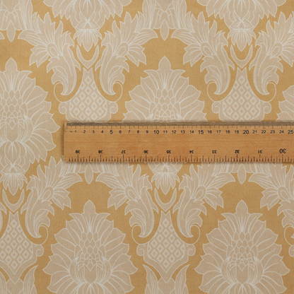 An elegant damask fabric featuring a repeating, symmetrical floral and leaf medallion pattern in cream over a warm ochre-gold background.