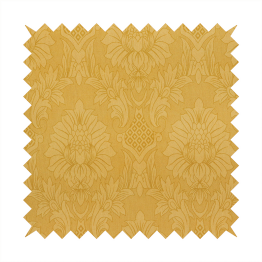 Luxurious tonal gold damask fabric featuring a repeating symmetrical floral medallion pattern in shimmering amber and matte ochre tones.