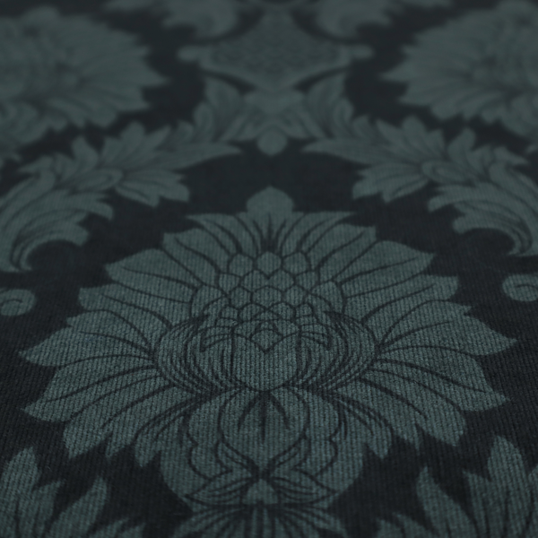 A dramatic, dark damask fabric featuring a large-scale floral medallion pattern in charcoal grey over a deep matte black background.