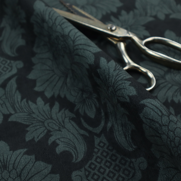A dramatic, dark damask fabric featuring a large-scale floral medallion pattern in charcoal grey over a deep matte black background.