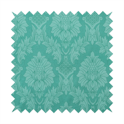 Vibrant teal damask fabric featuring a large-scale, repeating floral and acanthus leaf pattern in a tonal, monochromatic seafoam green colourway.