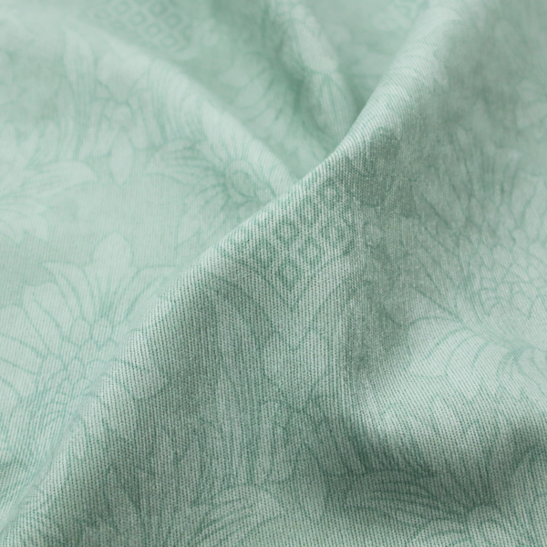 Pale ice blue damask fabric with a subtle, low-contrast floral medallion pattern in light pastel tones.