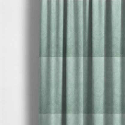 The fabric used to create these made-to-measure curtains is a pale ice blue damask fabric with a subtle, low-contrast floral medallion pattern in light pastel tones.