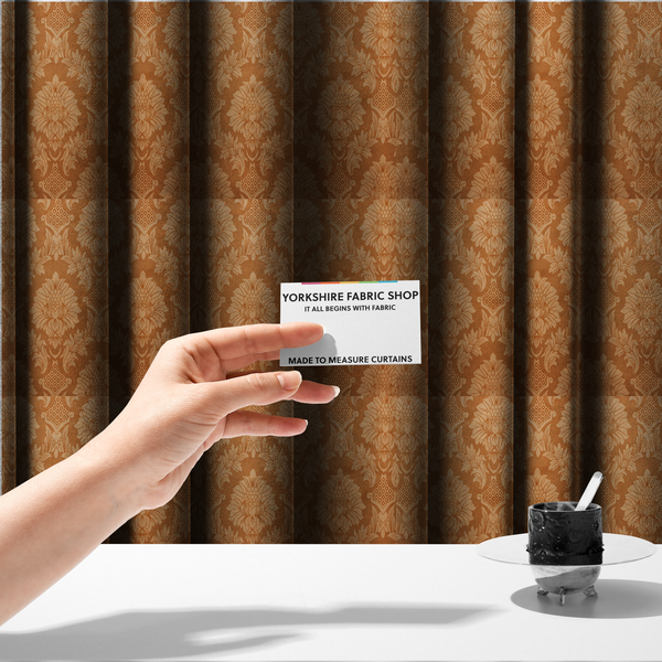 The fabric used to create these made-to-measure curtains is a warm brown damask fabric featuring a large-scale, repeating floral and acanthus leaf pattern in shimmering copper tones.