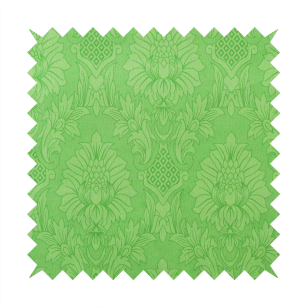 Vibrant apple green damask fabric featuring a repeating, large-scale floral medallion and acanthus leaf pattern in a tonal monochromatic colourway