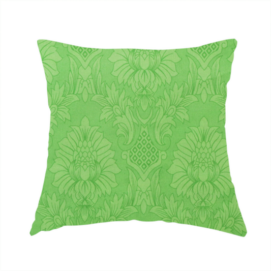 The fabric used to create this handmade cushion is a vibrant apple green damask fabric featuring a repeating, large-scale floral medallion and acanthus leaf pattern in a tonal monochromatic colourway.