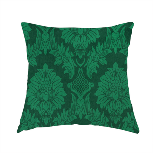 The fabric used to create this handmade cushion is a deep emerald green damask fabric featuring a large-scale, repeating floral and acanthus leaf pattern in a rich tonal colourway.