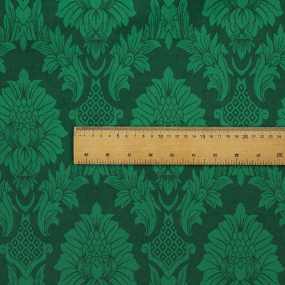 Deep emerald green damask fabric featuring a large-scale, repeating floral and acanthus leaf pattern in a rich tonal colourway.
