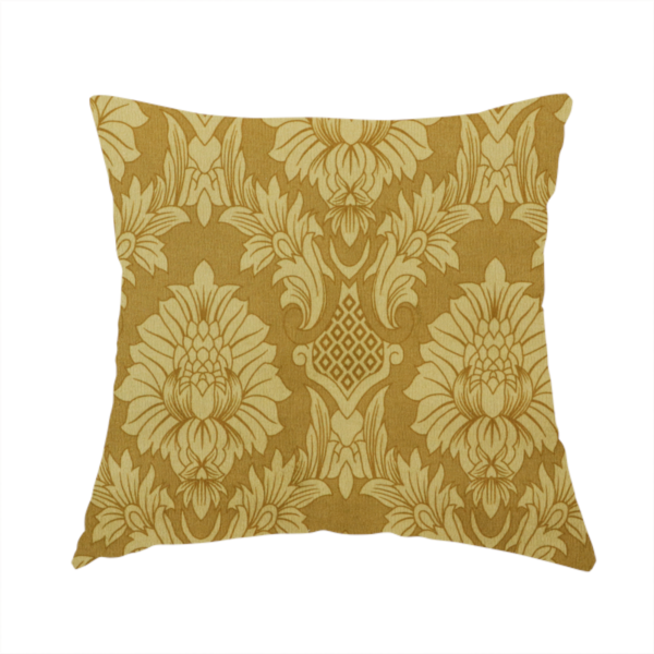 The fabric used to create this handmade cushion is a high-contrast damask fabric featuring a shimmering champagne-gold floral medallion pattern over a matte antique bronze background.