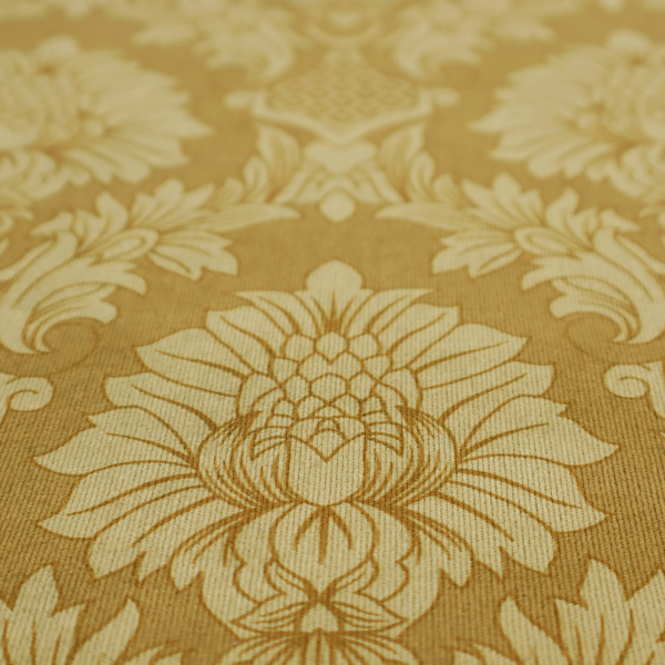 High-contrast damask fabric featuring a shimmering champagne-gold floral medallion pattern over a matte antique bronze background.