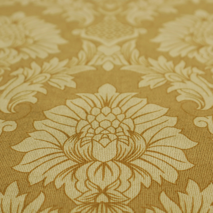High-contrast damask fabric featuring a shimmering champagne-gold floral medallion pattern over a matte antique bronze background.