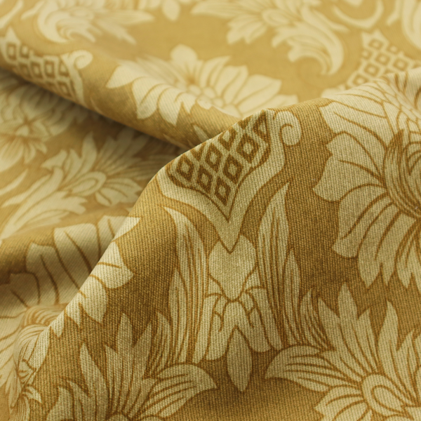 High-contrast damask fabric featuring a shimmering champagne-gold floral medallion pattern over a matte antique bronze background.