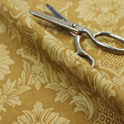 High-contrast damask fabric featuring a shimmering champagne-gold floral medallion pattern over a matte antique bronze background.