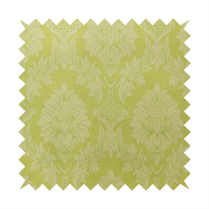 Bright lime-yellow damask fabric featuring a repeating, large-scale floral medallion pattern in a soft tonal colourway.
