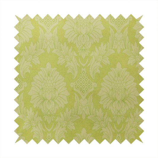 Bright lime-yellow damask fabric featuring a repeating, large-scale floral medallion pattern in a soft tonal colourway.
