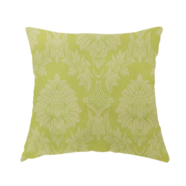 The fabric used to create this handmade cushion is a bright lime-yellow damask fabric featuring a repeating, large-scale floral medallion pattern in a soft tonal colourway.
