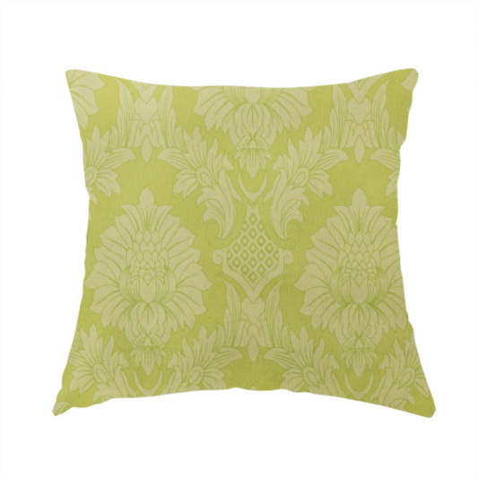 The fabric used to create this handmade cushion is a bright lime-yellow damask fabric featuring a repeating, large-scale floral medallion pattern in a soft tonal colourway.