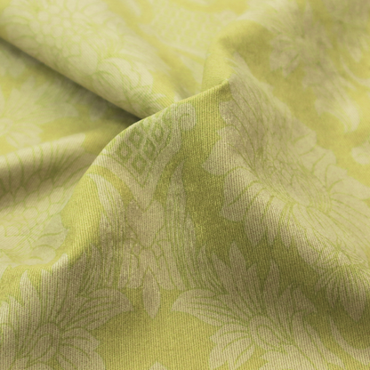 Bright lime-yellow damask fabric featuring a repeating, large-scale floral medallion pattern in a soft tonal colourway.
