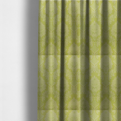 The fabric used to create these made-to-measure curtains is a bright lime-yellow damask fabric featuring a repeating, large-scale floral medallion pattern in a soft tonal colourway.