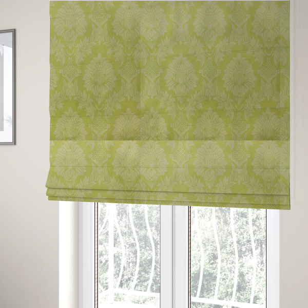 The fabric used to create these Roman blinds is a bright lime-yellow damask fabric featuring a repeating, large-scale floral medallion pattern in a soft tonal colourway.