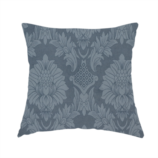 The fabric used to create this handmade cushion is a sophisticated slate blue damask fabric featuring a large-scale, repeating floral and acanthus leaf pattern in a tonal, steel grey colourway.