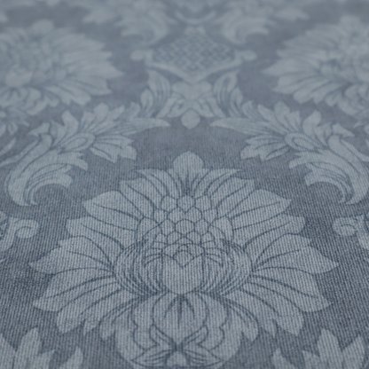 Sophisticated slate blue damask fabric featuring a large-scale, repeating floral and acanthus leaf pattern in a tonal, steel grey colourway.