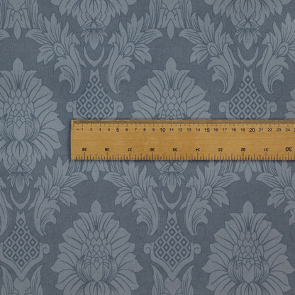 Sophisticated slate blue damask fabric featuring a large-scale, repeating floral and acanthus leaf pattern in a tonal, steel grey colourway.