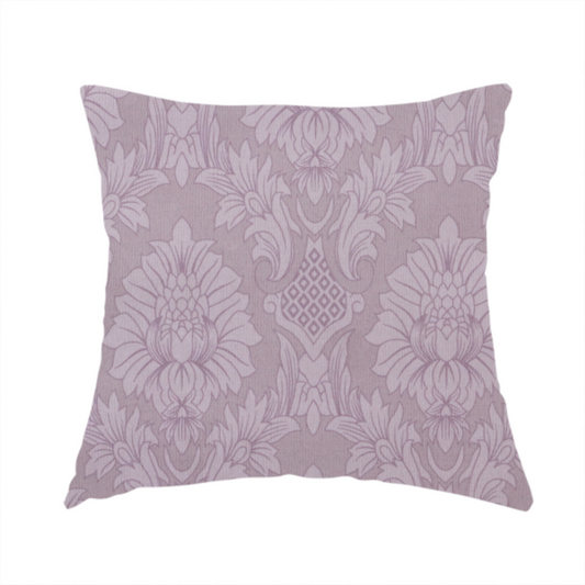 The fabric used to create this handmade cushion is a elegant lavender damask fabric featuring a large-scale, repeating floral and acanthus leaf pattern in a soft tonal lilac colourway.