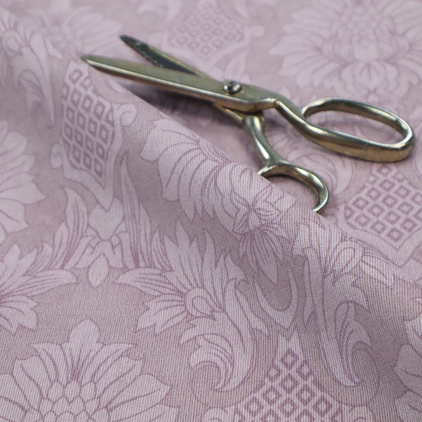 Elegant lavender damask fabric featuring a large-scale, repeating floral and acanthus leaf pattern in a soft tonal lilac colourway.
