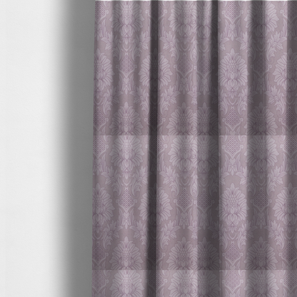 The fabric used to create these made-to-measure curtains is a elegant lavender damask fabric featuring a large-scale, repeating floral and acanthus leaf pattern in a soft tonal lilac colourway.