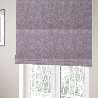 The fabric used to create these Roman blinds is a elegant lavender damask fabric featuring a large-scale, repeating floral and acanthus leaf pattern in a soft tonal lilac colourway.
