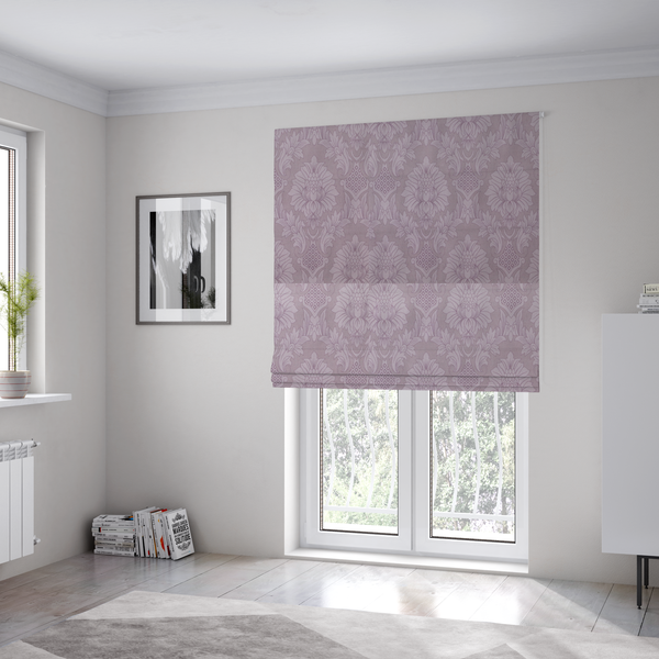 The fabric used to create these Roman blinds is a elegant lavender damask fabric featuring a large-scale, repeating floral and acanthus leaf pattern in a soft tonal lilac colourway.