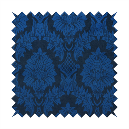 High-contrast damask fabric featuring a vibrant royal blue floral medallion pattern over a deep navy blue background.