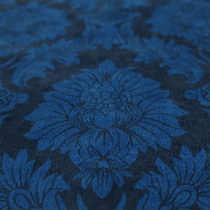 High-contrast damask fabric featuring a vibrant royal blue floral medallion pattern over a deep navy blue background.