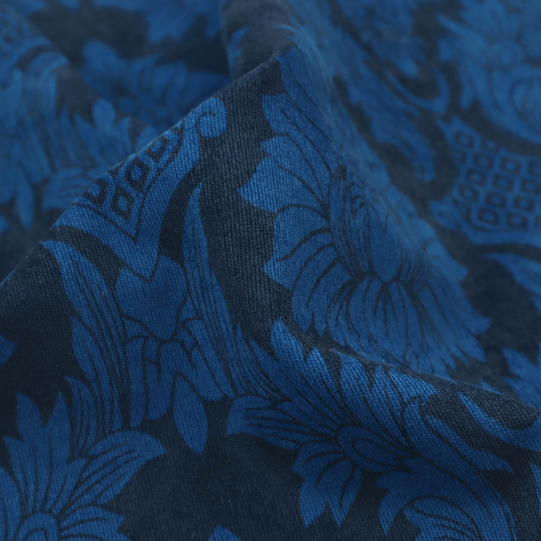 High-contrast damask fabric featuring a vibrant royal blue floral medallion pattern over a deep navy blue background.