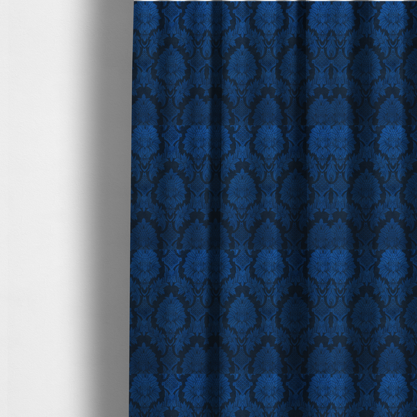 The fabric used to create these made-to-measure curtains is a high-contrast damask fabric featuring a vibrant royal blue floral medallion pattern over a deep navy blue background.